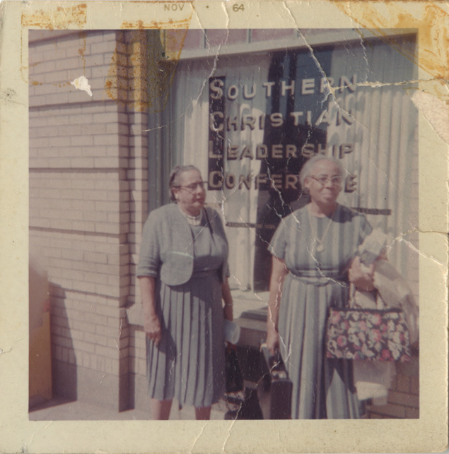 Color photograph of Septima P. Clark with friend outside Southern Christian Leadership Conference in Atlanta, Georgia. 1964. 