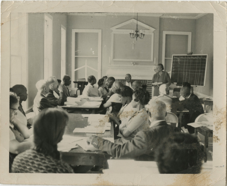 Black and white photograph of Septima P. Clark teaching a group of adults in Liberty County, Georgia. 1960s. 