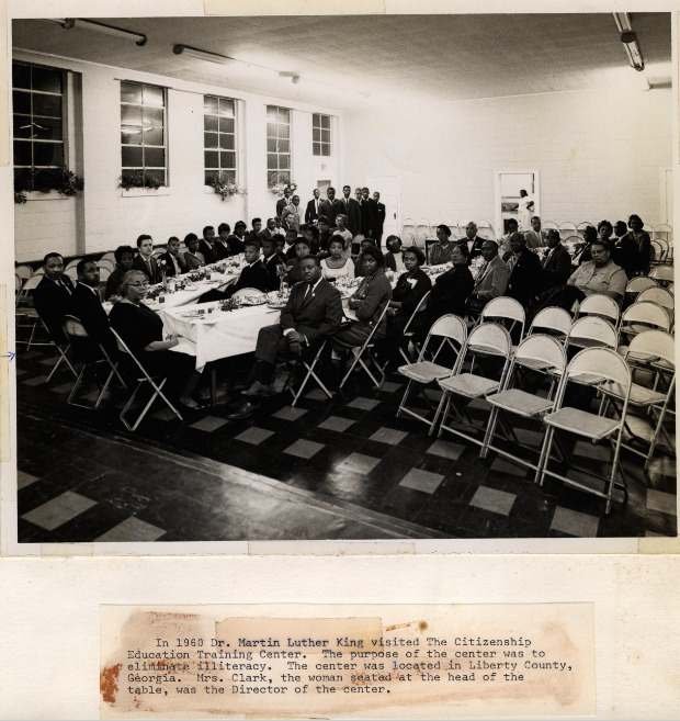Photo of SPC at the head of the table at The Citizenship Education Training Center in Liberty County, GA. 1960? In Septima P. Clark Scrapbook. 